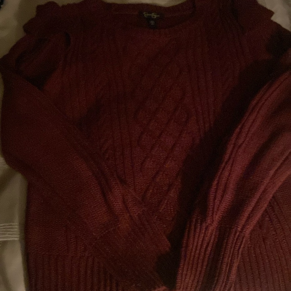 Med. pullover sweater with a ruffle at each shoulder. Acrylic.